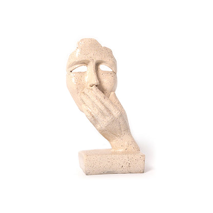 Abstract Woman Face Sculpture in Desert Sand