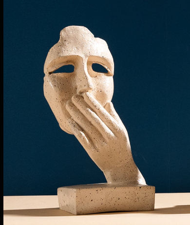 Abstract Woman Face Sculpture in Desert Sand